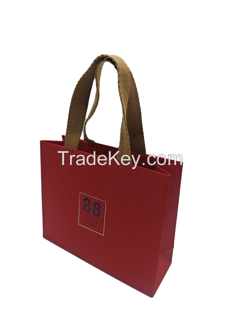 Luxury Custom Logo Gift Paper Bags â Recyclable Kraft/Art Paper, Gold Foil Hot Stamping & Arabic Embossing â Perfect for Wedding, Clothing, Cosmetics & Corporate Bulk Orders with Ribbon Accents