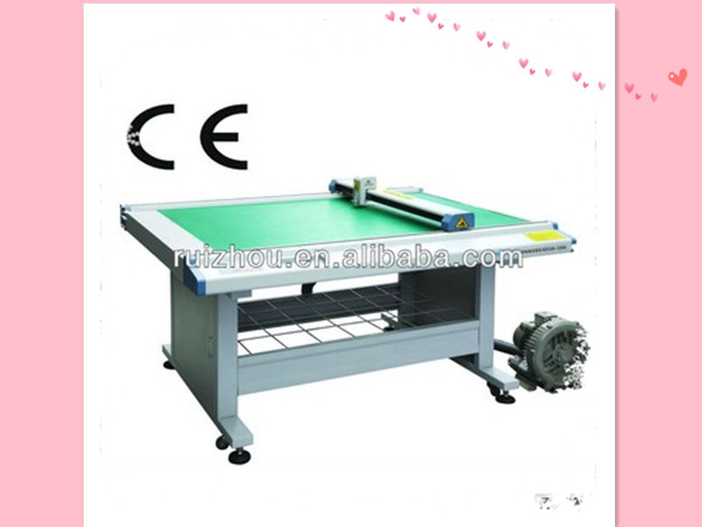 Computerized footwear and garment pattern cutting machine