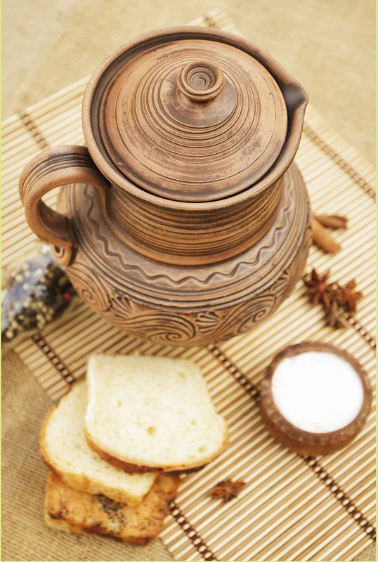 Clay jug, jar, pitcher with a lid.