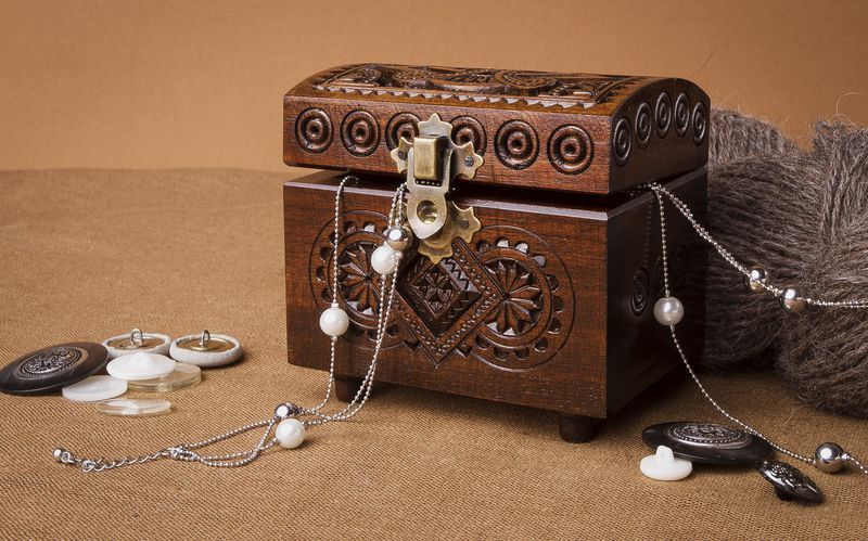 Small wooden brown jewelry box.