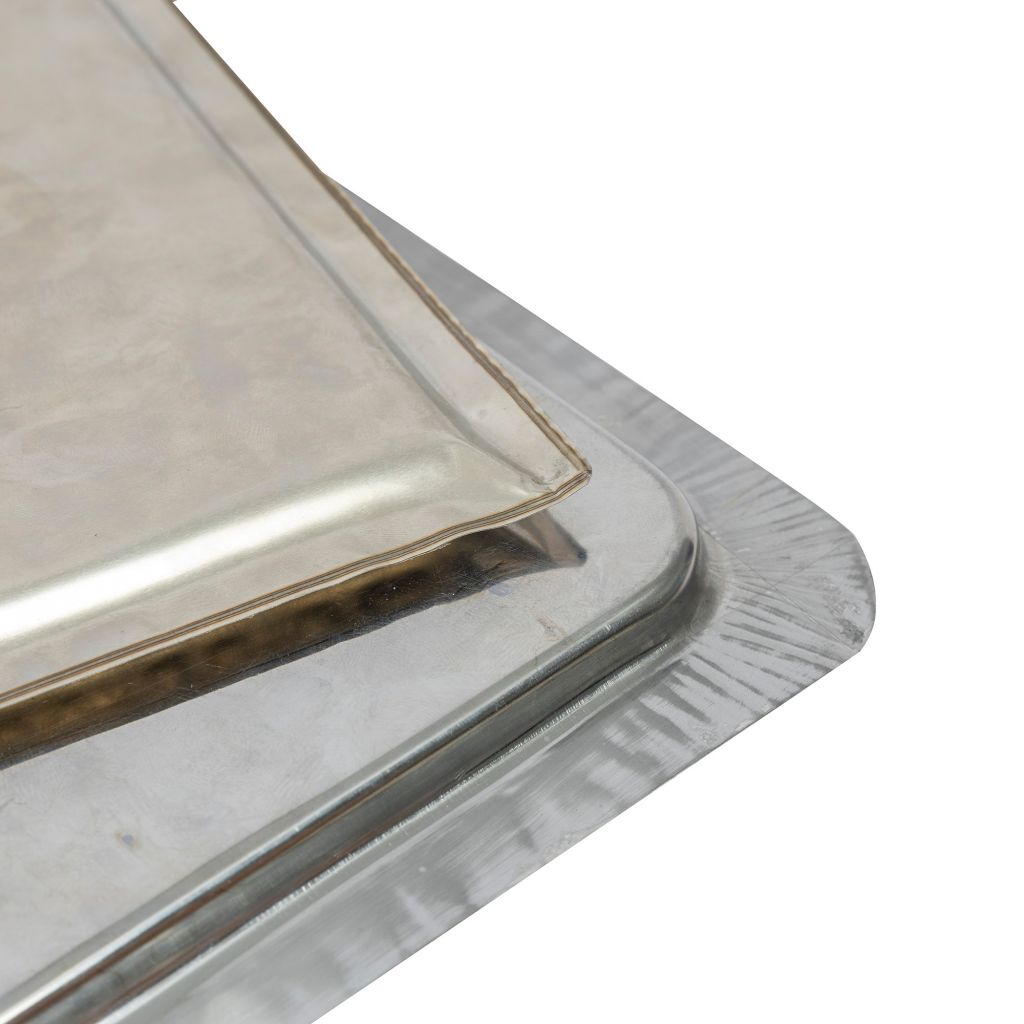 Wide temperature range vacuum insulation panel