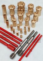 Top hammer rock drilling tools