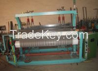 shuttless weaving machine